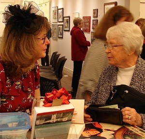 Elinor Florence speaks with a reader at Peachland Gallery, Peachland, B.C.