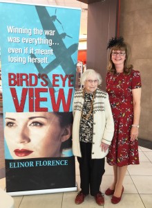 Elinor wearing a vintage wartime outfit at a book signing in West Vancouver, with Air Force veteran Ruth Nesbitt.