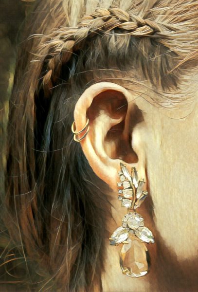 A photo of a girl's ear and earrings